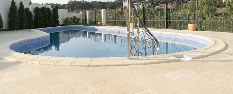 10 Reasons to Use Natural Stone as Pool Coping  